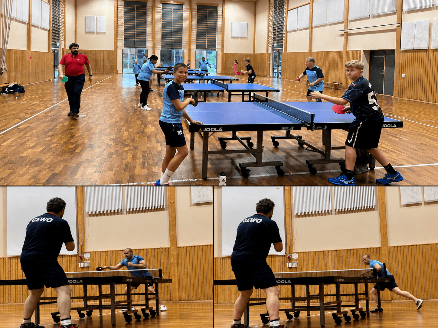 People playing table tennis on multiple blue tables in a large, wooden-floored indoor gymnasium.